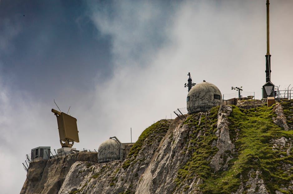 Swiss radar system perched on a rugged mountainside, showcasing technical and natural contrast.